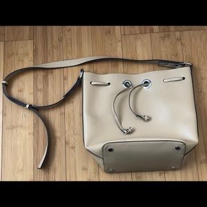 Cream colored shoulder bag with silver hardware